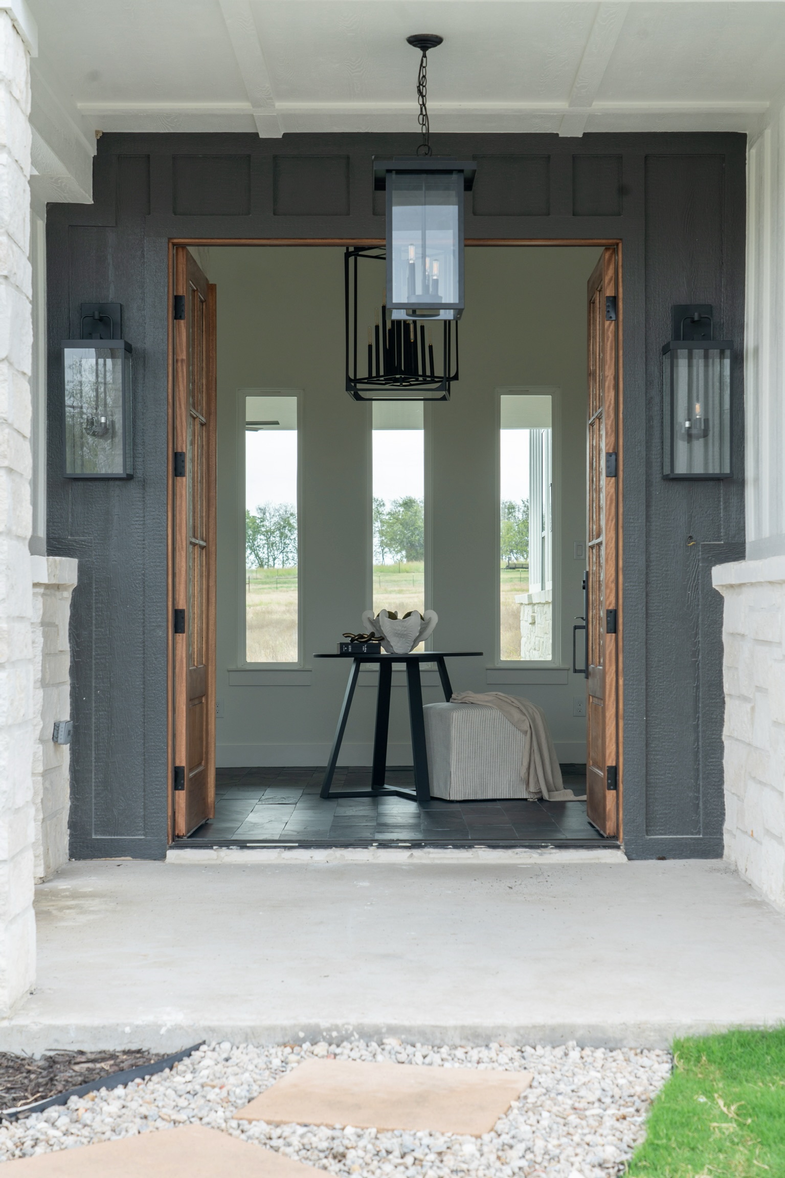 The Morgan entry with stone fireplace and double doors